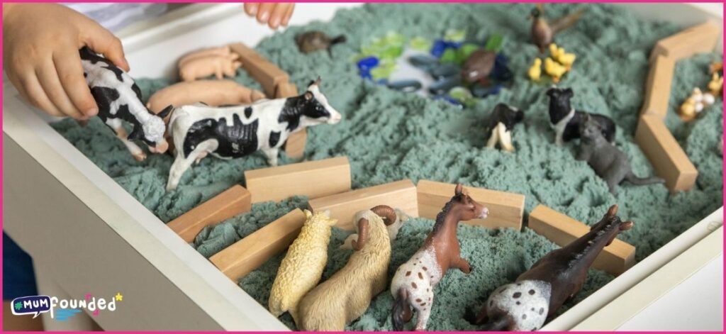 Summer Sensory Play Ideas for preschoolers - kinetic sand and toy farm animals