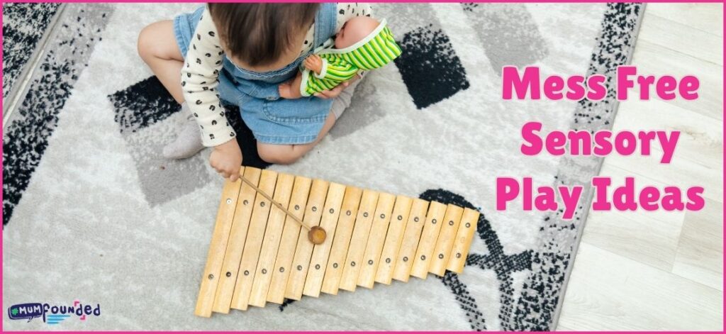 Text: Mess Free Sensory Play Ideas.Image" Toddler playing wooden xylophone