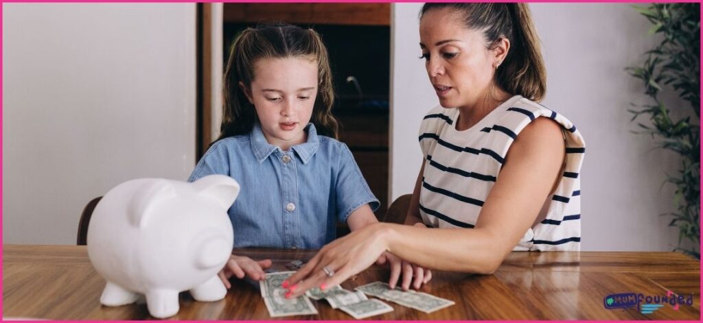 money saving hacks for parents - Mum getting daughter to count the cash in her piggy bank
